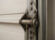 Worn garage door hinge and roller causing noise - Chesapeake VA garage door repair